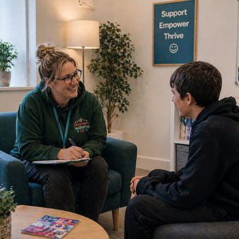 Teenager talking with counsellor in Wrexham